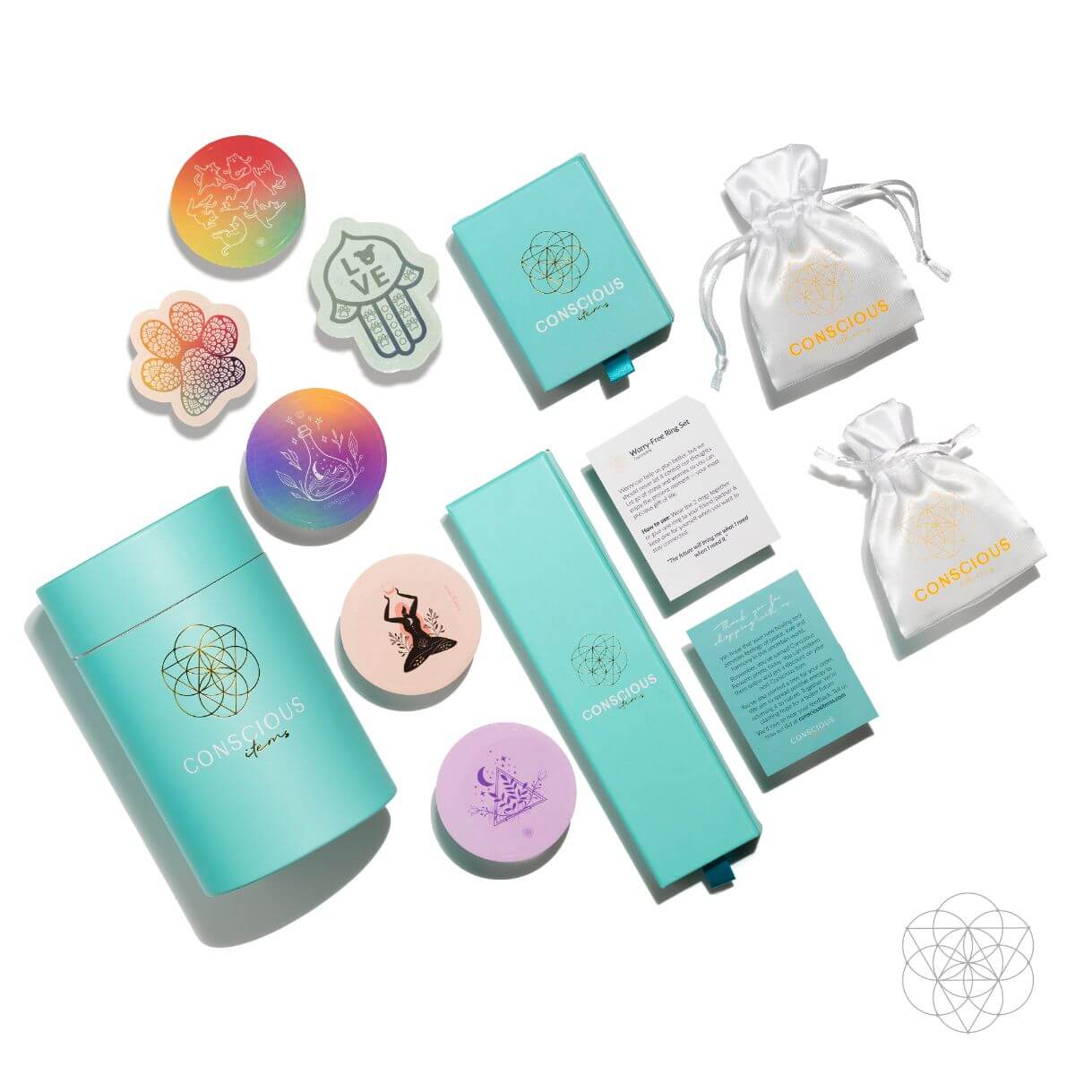 Collection of colorful items including notebooks, cards, and pouches with a brand logo on a white background. Spiritual GPS Guardian Car Vent Crystal Clip Kit | Protection Crystals for Safe Travel & Positive Energy