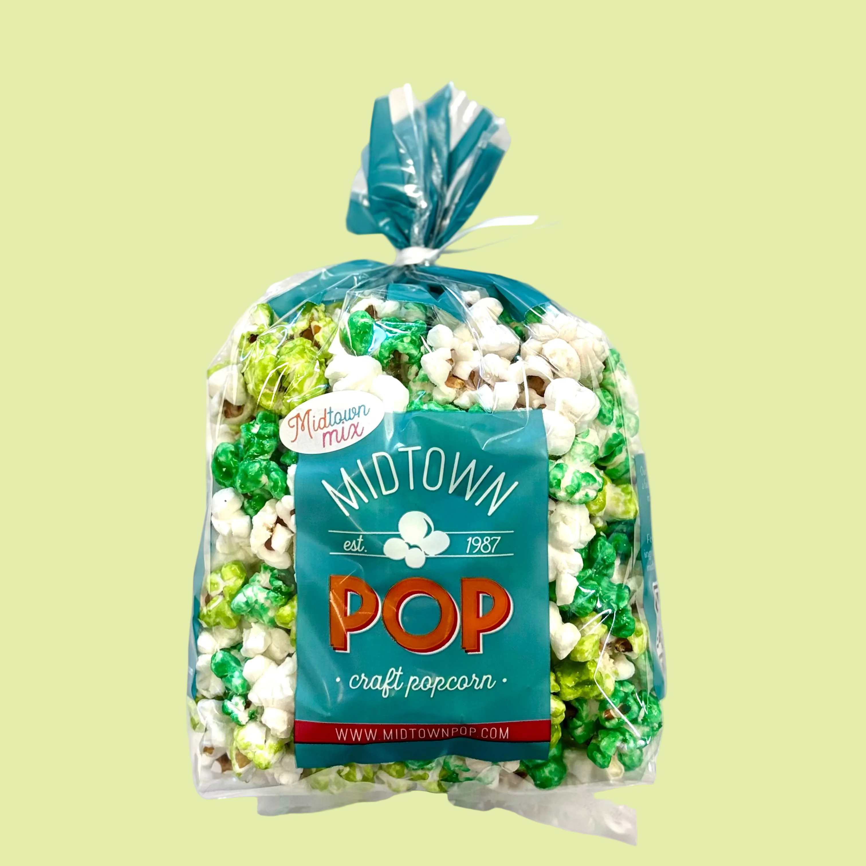 Bag of Midtown Pop craft popcorn on a light green background