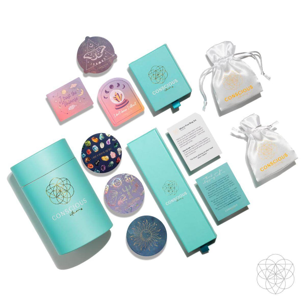 Collection of turquoise and pastel-colored items with 'Conscious' branding on a white background. The Visualization Ring: Brass, Platinum and Amethyst