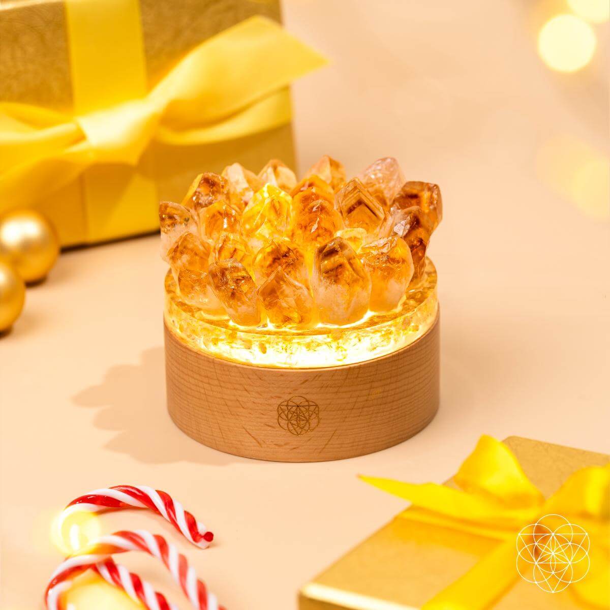 Decorative crystal lamp with wooden base on a festive background with presents and candy canes. Turn My Life to Gold - Midas Citrine Lamp