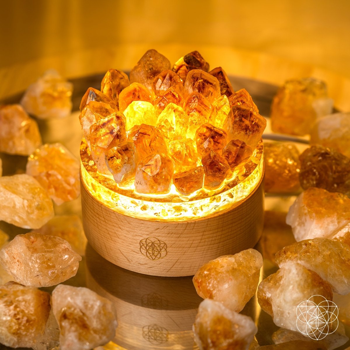 Decorative lamp with glowing interior surrounded by amber crystals on a reflective surface. Turn My Life to Gold - Midas Citrine Lamp