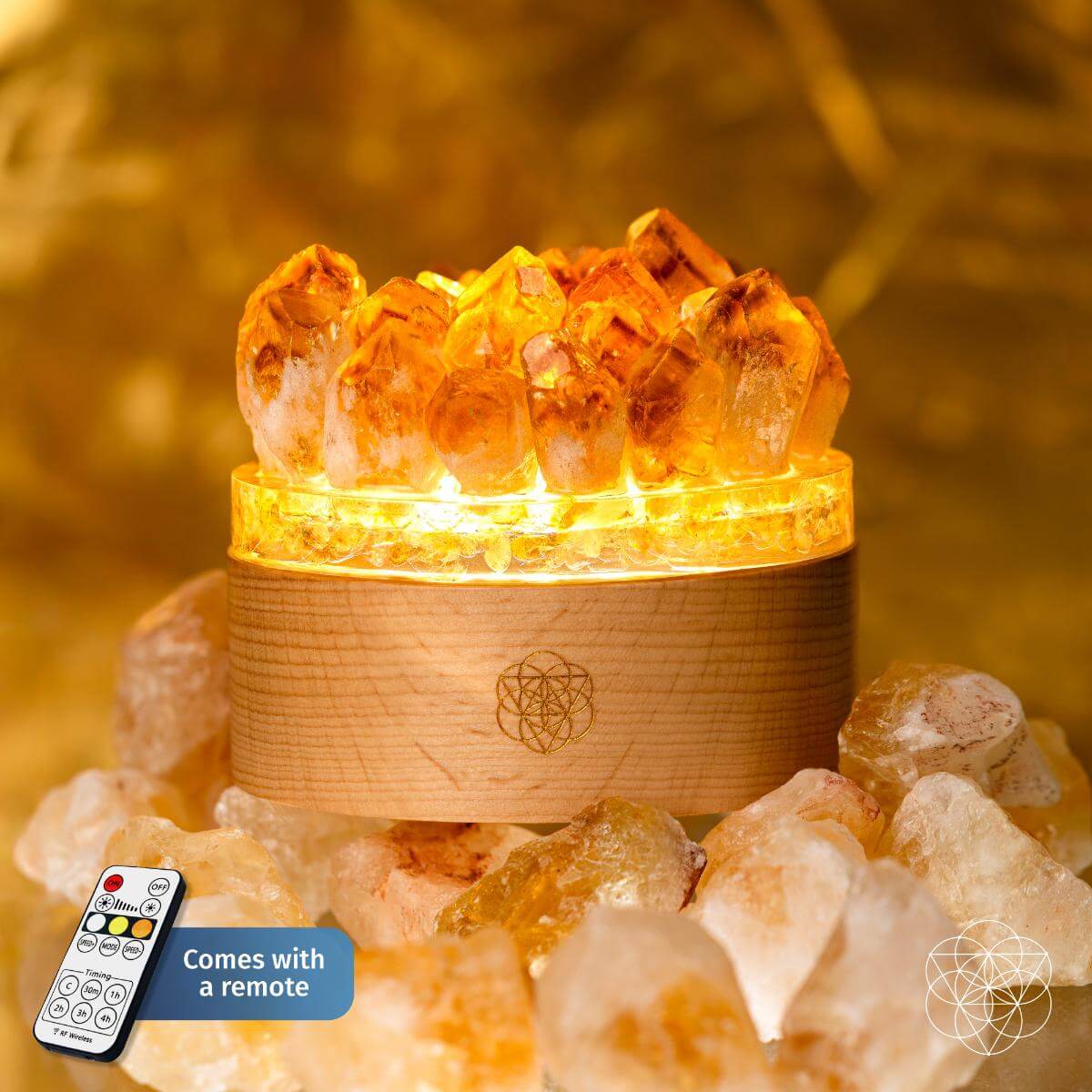 Decorative lamp with crystal-like design on a wooden base, surrounded by similar crystals, with a remote control displayed. Turn My Life to Gold - Midas Citrine Lamp