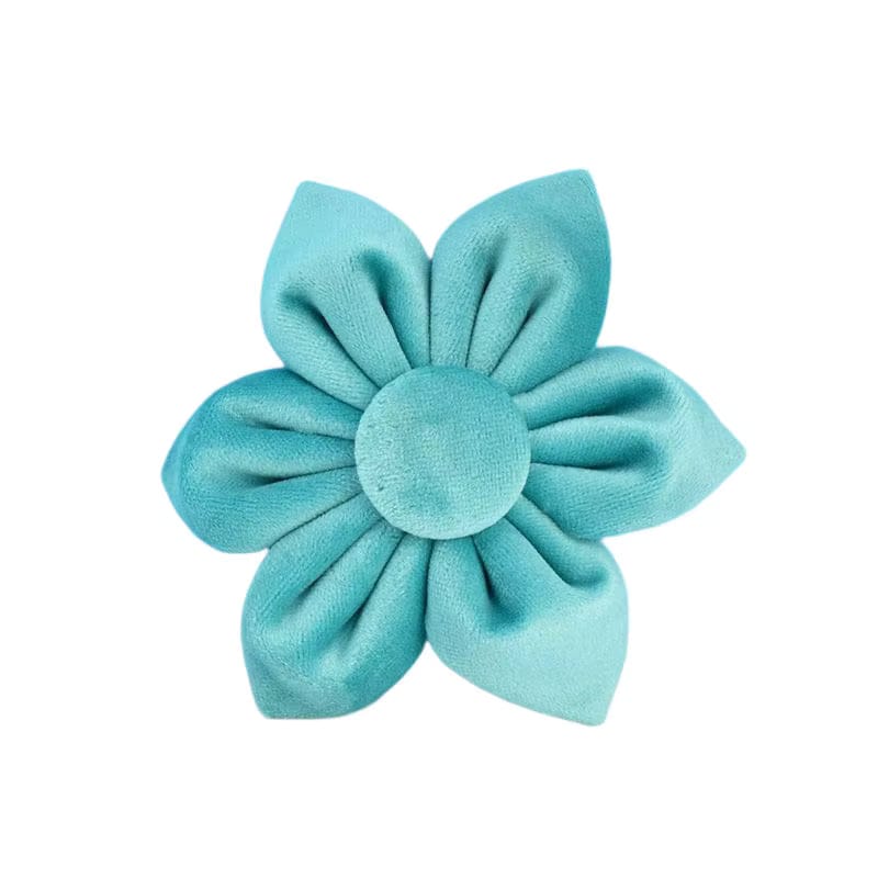 Turquoise flower-shaped hair clip on a white background