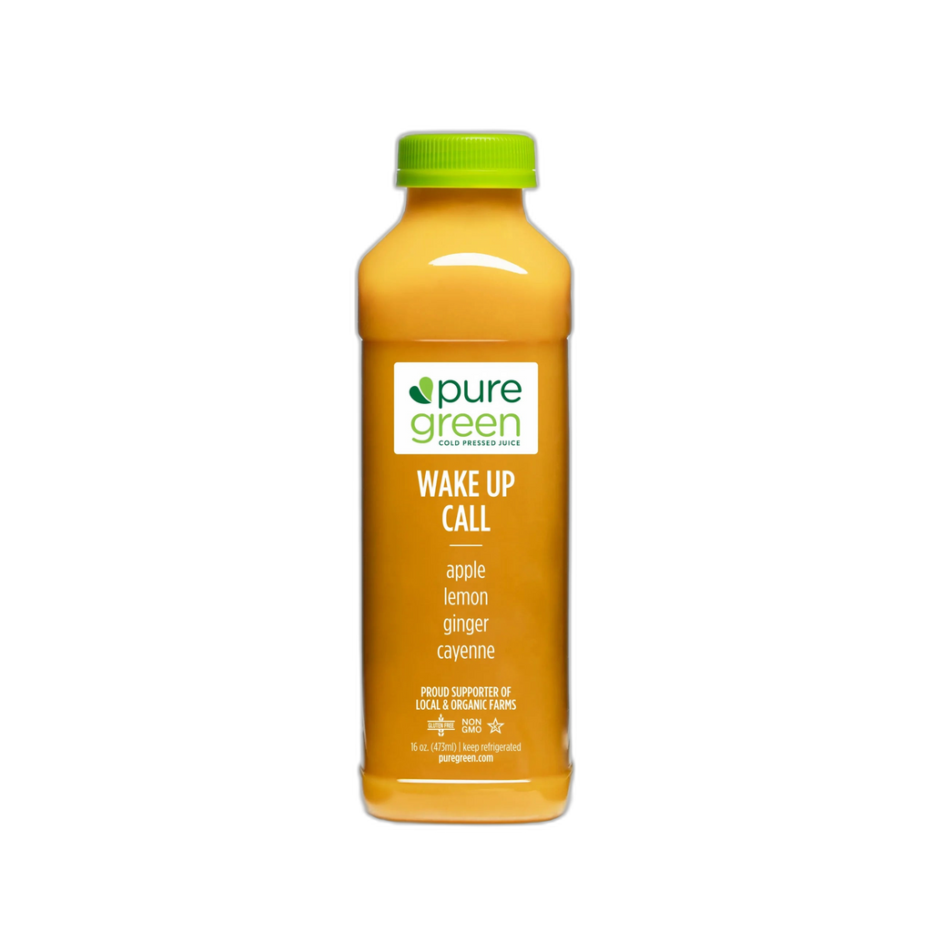Orange juice bottle with green cap labeled 'pure green' on a white background. PURE GREEN WAKE UP CALL Cold-Pressed NON-GMO Juice Drink with Apple, Lemon, Ginger and Cayenne, No Added Sugar, Gluten-Free