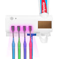 Colorful toothbrushes with a UV light and toothpaste tube on a white  background Wall Mounted Toothbrush Sanitizer Holder IR Induction UV Sanitization Rack