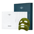 Whamisa Organic Algae Kelp Mask set, featuring a dark blue outer box, white individual sachets, and two green kelp sheet masks in front, on a clean white background.