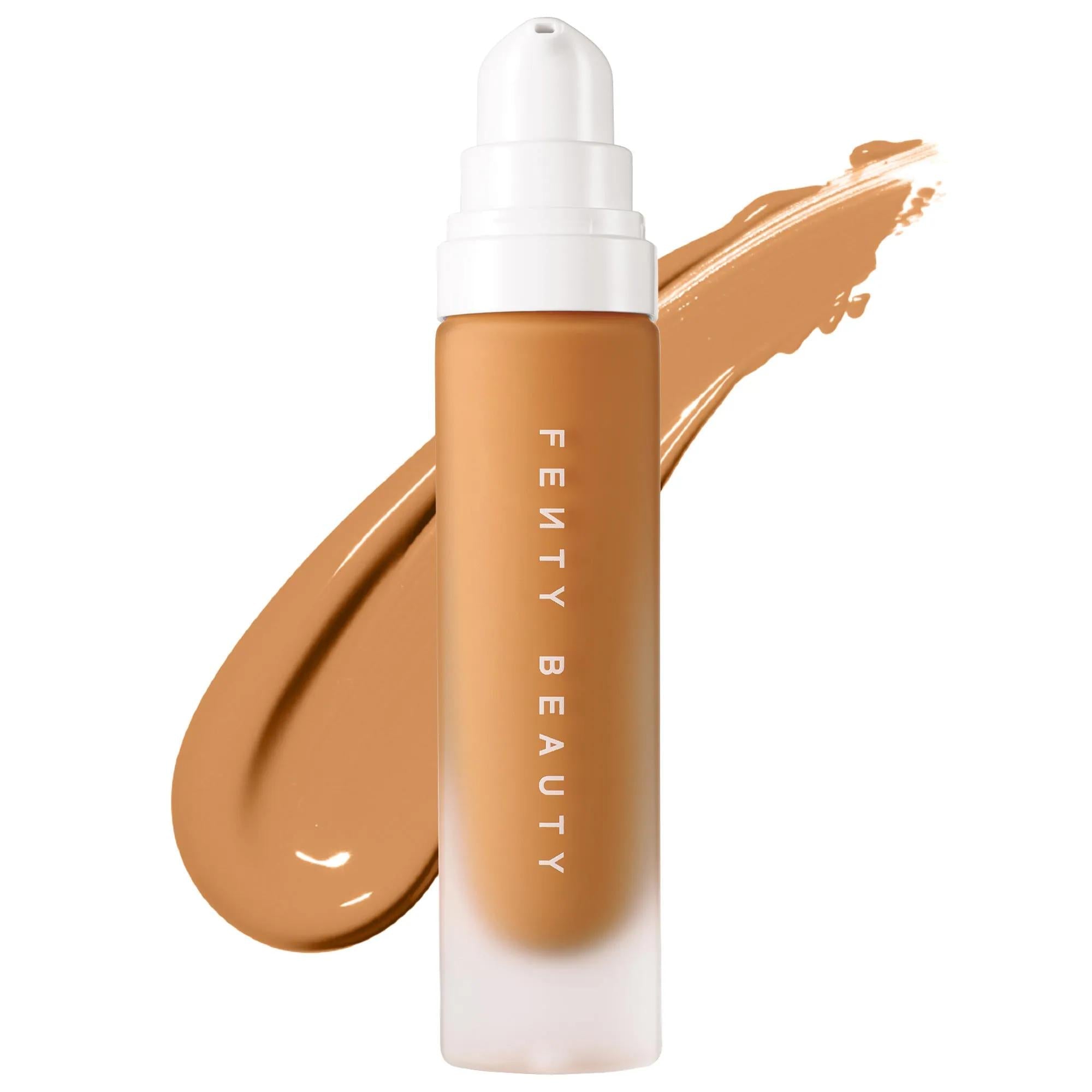 Fenty Beauty Pro Filt'r Soft Matte Longwear Liquid Foundation Shade 310 bottle with a warm tan shade swatch on a clean white background. Matte-frosted pump bottle showcases long-wearing liquid foundation with a smooth, full-coverage finish.